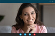 © fizkes - Head shot portrait computer screen view Arabic woman looking at camera, chatting with friends or family online, using social media apps, happy female making video call at home, engaged conference