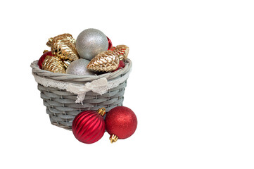 Christmas decorations in a basket on a white background