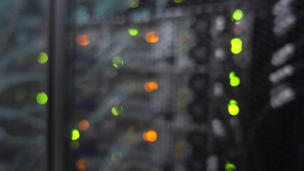 Wall Mural - Beautiful bokeh. Server rack with flashing lights. Video contains noise
