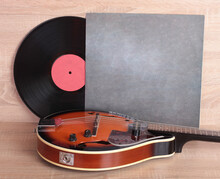 Vintage Vinyl Discs And Country Mandolin On Wooden Background