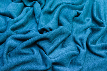 Crumpled blue fabric background and texture. Abstract background, empty template