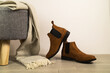 Women autumn shoes or chelsea boots on floor. Autumn fashion concept.