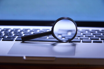 Magnifying glass on computer keyboard