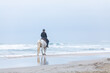 © emmapeel34 - woman on a horse on the beach on a cloudy day