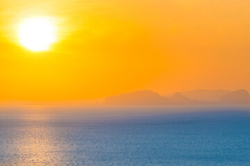 Wall Mural - many small islands landscape on sunset sea with colorful sunset sky