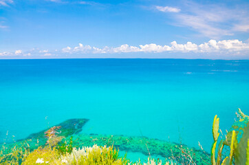 Wall Mural - Watercolor drawing of Aerial top view of beautiful amazing Tyrrhenian sea with turquoise water, tropical seascape, endless horizon with blue sky, reef foreground, Tropea, Calabria, Southern Italy