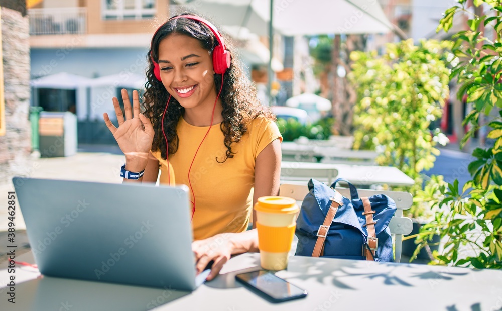 Young african american student girl doing video call using laptop at ...