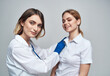 © SHOTPRIME STUDIO - Happy woman doctor in blue gloves and female patient in white t-shirt stethoscope medical gown