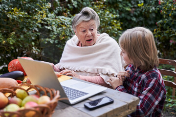 Surprised grandmother and her grandson