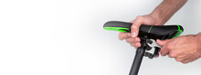 Adjusting And Repairing A Bicycle Saddle. Isolated Horizontal Photo. Copyspace For Text.