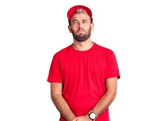 Sticker - Young handsome blond man wearing t-shirt and cap depressed and worry for distress, crying angry and afraid. sad expression.