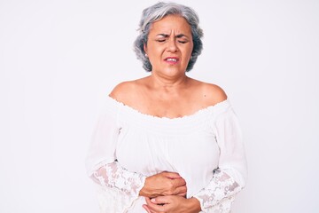 Poster - Senior hispanic grey- haired woman wearing casual clothes with hand on stomach because indigestion, painful illness feeling unwell. ache concept.