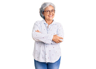 Poster - Senior woman with gray hair wearing casual business clothes and glasses happy face smiling with crossed arms looking at the camera. positive person.