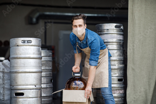 Startup, brewery, plant and work in warehouse with barrels