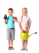 Cute Little Children With Gardening Supplies On White Background