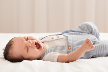 Sticker - Cute little baby lying on bed at home