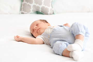 Sticker - Cute little baby lying on bed at home