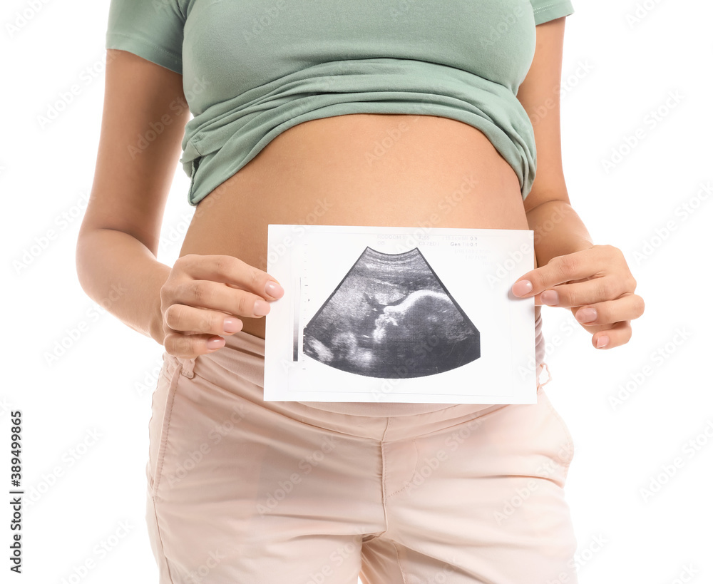 Beautiful pregnant woman with sonogram image on white background
