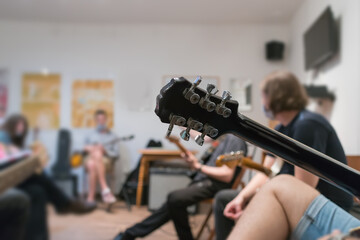playing guitar at guitar lesson