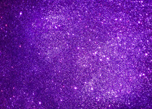 Violet Abstract Sparkle Background Reminding Starry Night Sky. Purple Glitter Texture Of Decoration Material. 