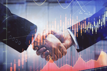 Double exposure of forex graph hologram and handshake of two men. Stock market concept.