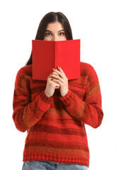 Poster - Beautiful young woman with book on white background