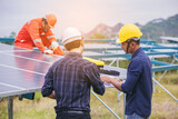 Fototapeta  - Electrical, instrument technician and foreman discuss to plan to maintenance electric system at solar panel field