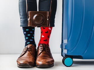 Men's legs, trendy shoes and bright socks. Close-up. Style, beauty and elegance concept