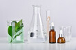 © ARTFULLY-79 - Natural skincare beauty product research, Organic botany extraction in scientific glassware at science laboratory, Blank cosmetic bottle container for branding mock-up.