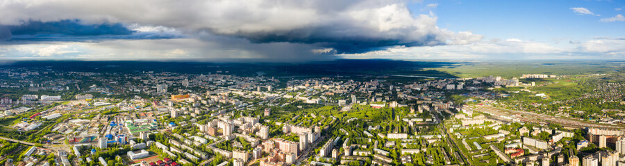 Wall Mural - Panorama of the Kirov city and pioneer palace in Leninsky district in the central part of the city of Kirov on a summer day against the backdrop of thunderstorms and storms.