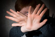 © Aleksey 159 - Scared child boy shows hand gesture to stop violence. Human rights day concept.