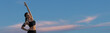 © Mountains Hunter - Female posing in sportswear on sky background. The middle part of the body.