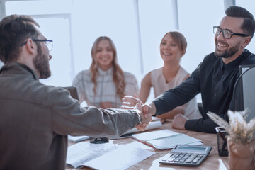 Wall Mural - smiling businessman at a working meeting in the office