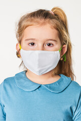 Canvas Print - Little blonde girl wearing face mask