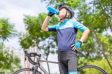 Wall Mural - elder biker drink water