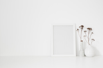 Wall Mural - Frame mockup and vase with branches on bookshelf. 