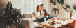 © Alex from the Rock - Family relationship. Happy couple at home on the couch watching movie using laptop
