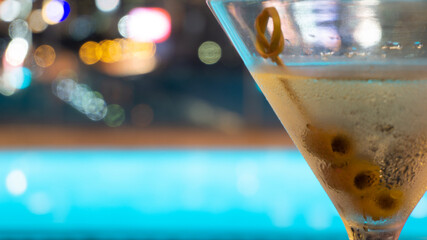 Wall Mural - night atmosphere in a bar restaurant with wine glasses alcohol, abstract bokeh blurred background,