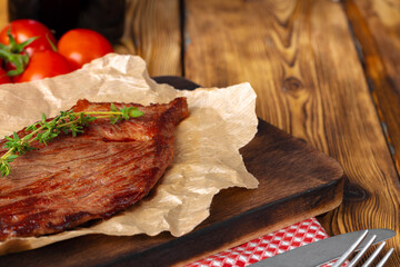 Grilled beef steak served on plate close up