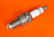 © ovcerleonid - Car spark plug on orange background