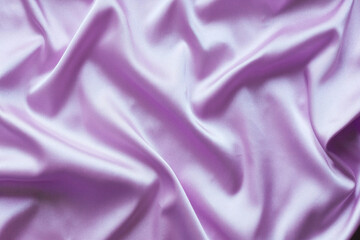 Smooth elegant lilac silk with soft folds can be used as background