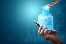 Online Voting, Hand With A Hologram Ballot And A Box For Internet Voting In A Mobile Phone On A Blue Background. Mixed Environment, E-voting Technology Concept.