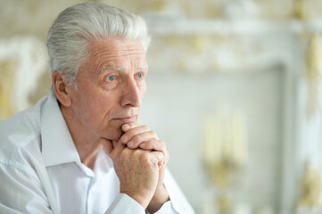 Poster - Close-up portrait of sad thinking senior man