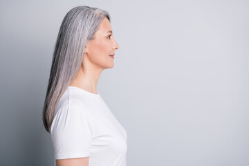 Poster - Profile photo of retired old lady look empty space wear white t-shirt isolated grey color background