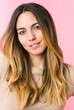 © Asier - Young beautiful woman isolated on pink background
