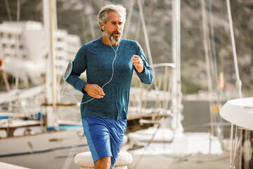 Active senior man jogging on a sunny day