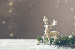 © Ivanna Pavliuk - Christmas card conception. Christmas toy deer decoration with christmas tree branch and snow
