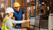 © Gorodenkoff - In Retail Warehouse Manager Uses Computer with Inventory Checking Software, Talks with Storehouse Worker about Package Delivery. International Distribution Center with Shelves Full of Products