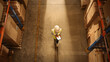 © Gorodenkoff - Top-Down View: Worker Wearing Hard Hat Checks Stock and Inventory Using Digital Tablet Computer in the Retail Warehouse full of Shelves with Goods. Working in Logistics, Distribution
