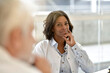 © goodluz - Portrait of young woman doctor attending meeting